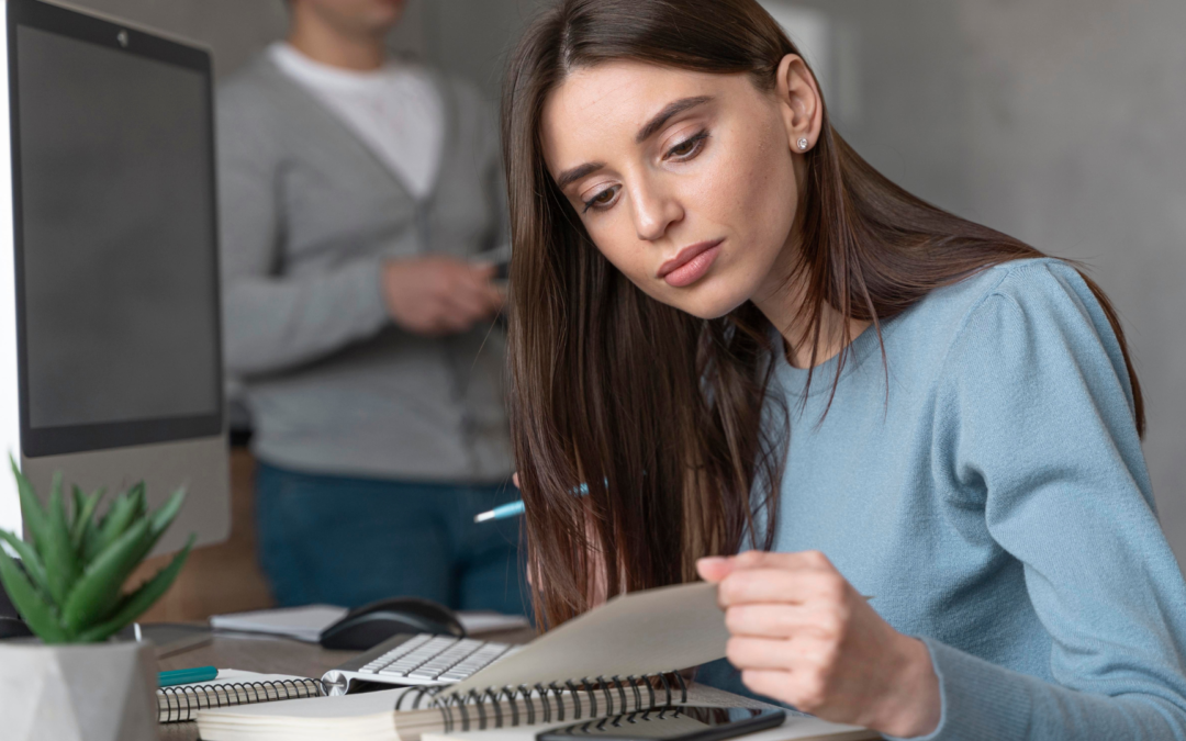 Entrepreneur reviewing financial documents for acquiring a cash-flowing small business to build an empire.